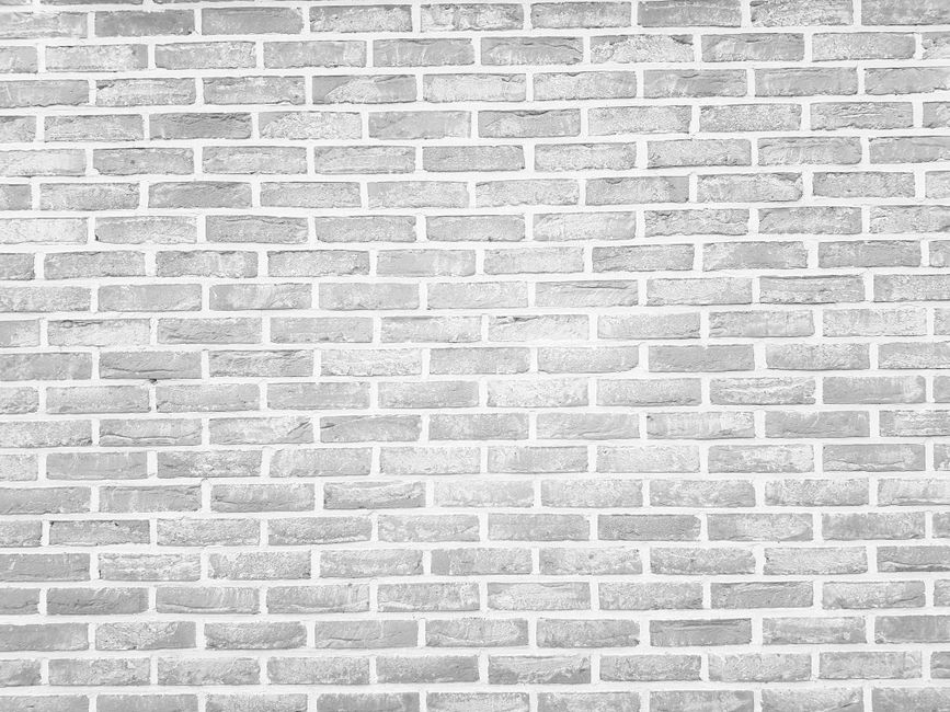Industrieel bakstenen fotobehang in hippe woonruimte.
